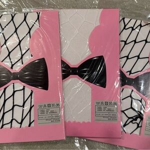3 Packaged Fishnet Tights with 2 black 1 white small-3x